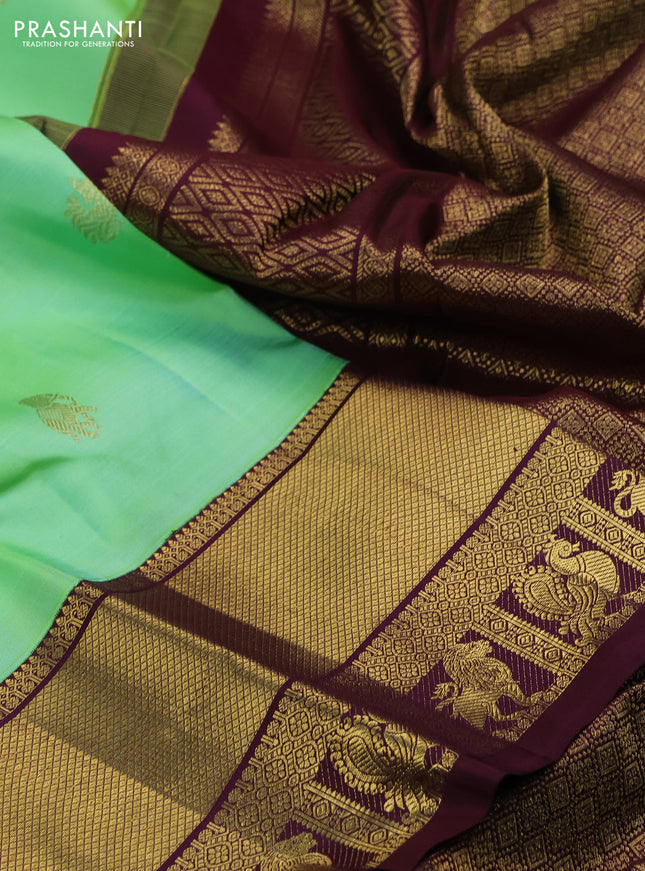 Pure kanchipuram silk saree teal green and wine shade with zari woven buttas and zari woven korvai border