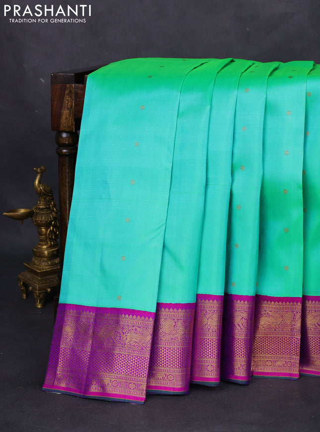 Pure kanchipuram silk saree teal green and purple with zari woven buttas and zari woven korvai border