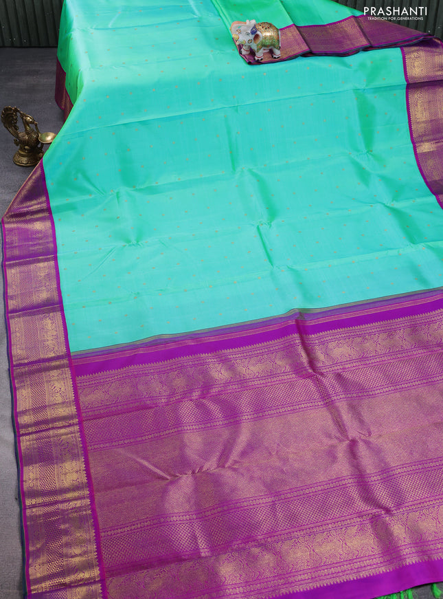 Pure kanchipuram silk saree teal green and purple with zari woven buttas and zari woven korvai border