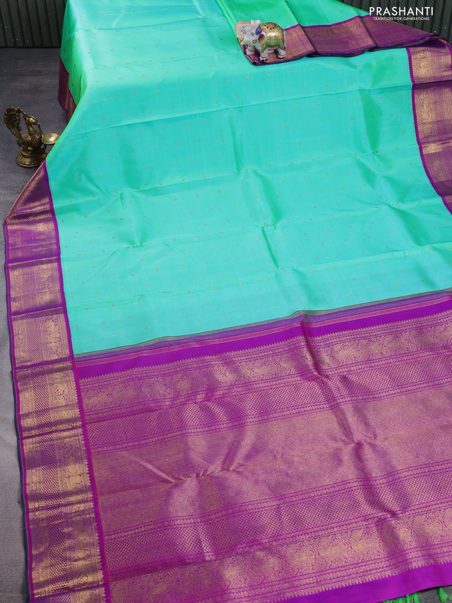 Pure kanchipuram silk saree teal green and purple with zari woven buttas and zari woven korvai border