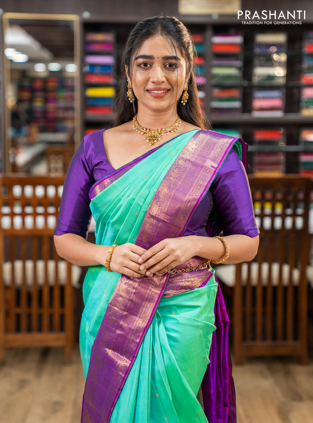 Pure kanchipuram silk saree teal green and purple with zari woven buttas and zari woven korvai border