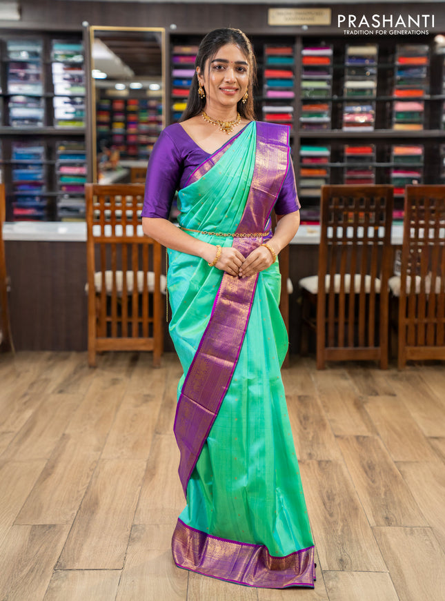 Pure kanchipuram silk saree teal green and purple with zari woven buttas and zari woven korvai border