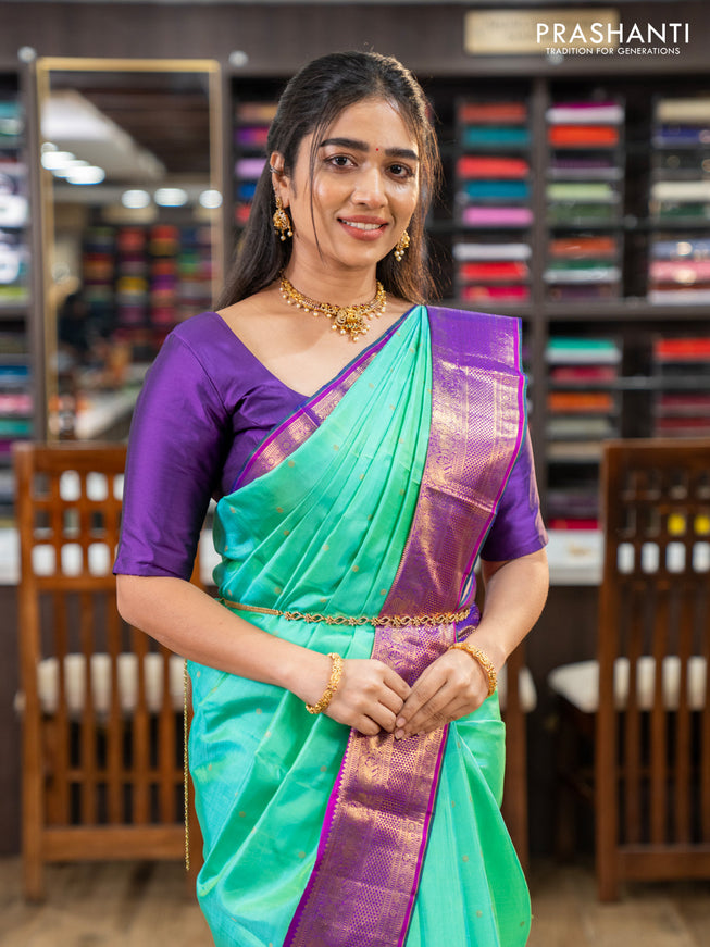 Pure kanchipuram silk saree teal green and purple with zari woven buttas and zari woven korvai border