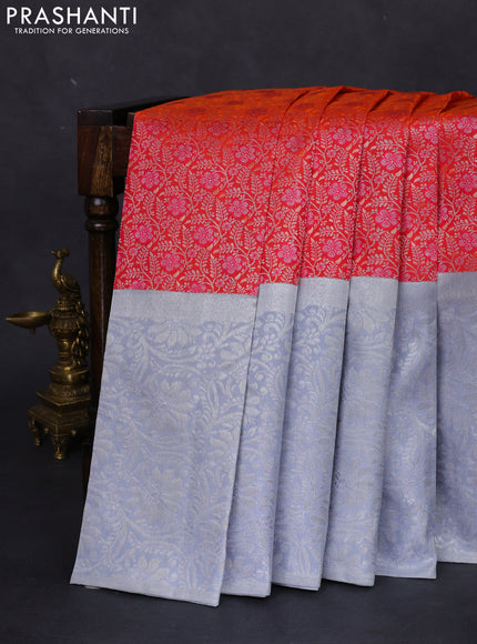 Pure kanchipuram silk saree dual shade of pinkish orange and pastel grey with allover silver zari brocade weaves and long rich silver woven border