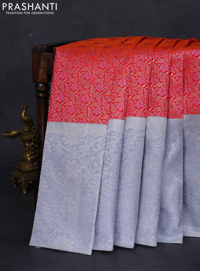 Pure kanchipuram silk saree dual shade of pinkish orange and pastel grey with allover silver zari brocade weaves and long rich silver woven border