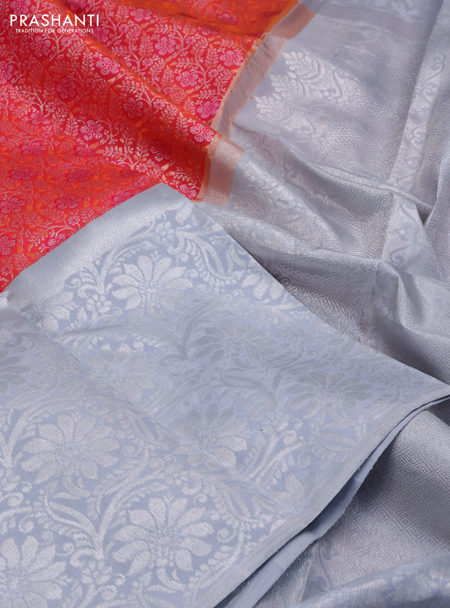Pure kanchipuram silk saree dual shade of pinkish orange and pastel grey with allover silver zari brocade weaves and long rich silver woven border