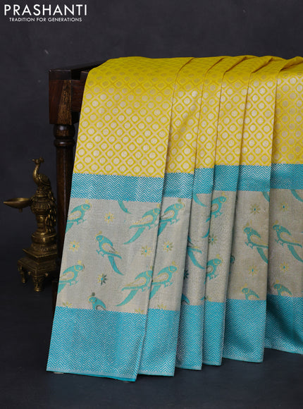 Pure kanchipuram silk saree lime yellow and teal blue with allover silver zari brocade weaves and long rich silver woven border
