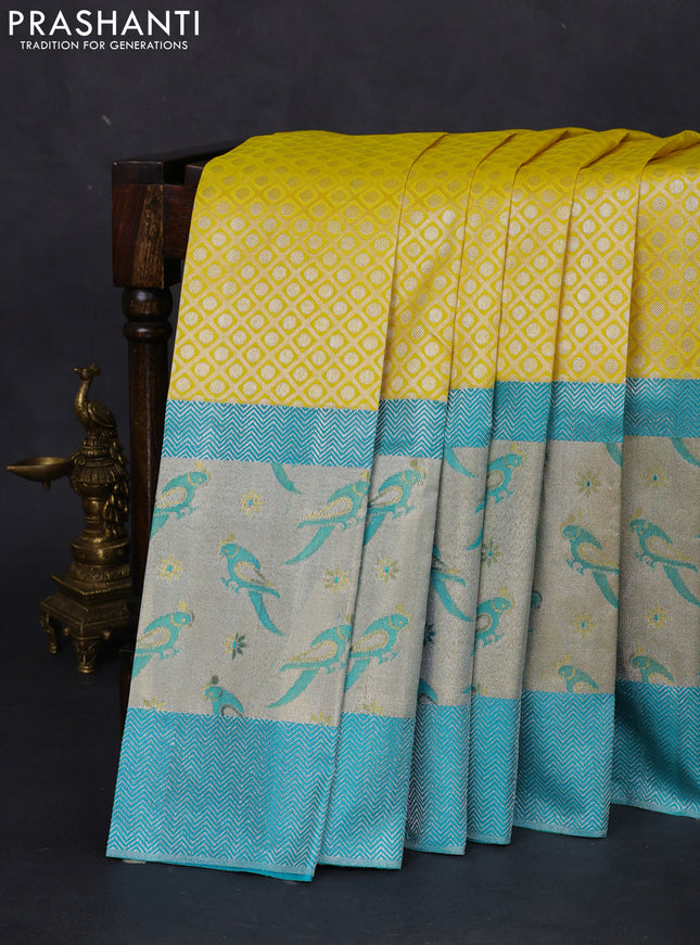 Pure kanchipuram silk saree lime yellow and teal blue with allover silver zari brocade weaves and long rich silver woven border