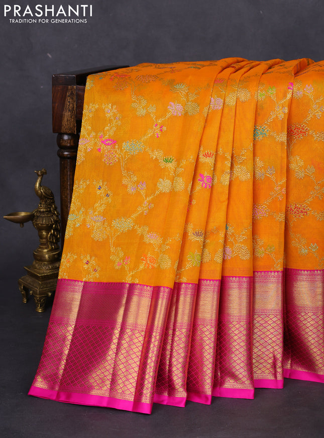 Kanchipuram kora silk saree orange and pink with allover floral zari weaves and zari woven border