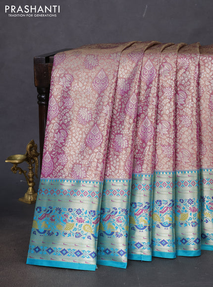 Tissue paithani silk saree dual shade of lavender and teal green with allover silver zari woven brocade weaves and zari woven paithani style border