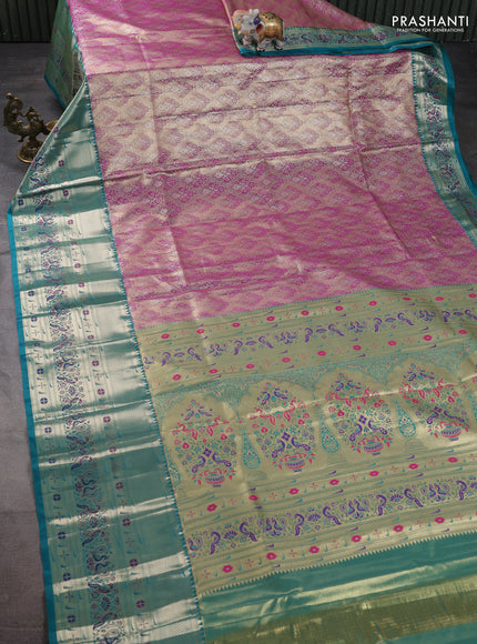 Tissue paithani silk saree dual shade of purple shade and teal green with allover silver zari woven brocade weaves and long zari woven paithani style border