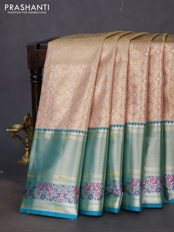 Tissue paithani silk saree dual shade of sandal and teal green with allover silver zari woven brocade weaves and long zari woven paithani style border
