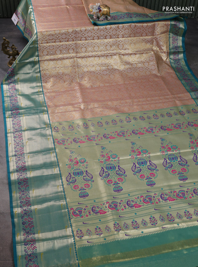 Tissue paithani silk saree dual shade of sandal and teal green with allover silver zari woven brocade weaves and long zari woven paithani style border