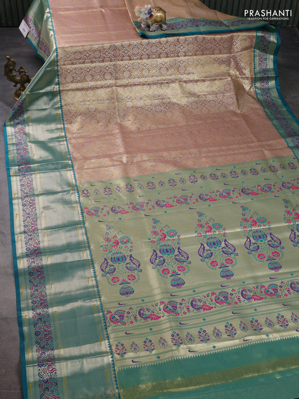 Tissue paithani silk saree dual shade of sandal and teal green with allover silver zari woven brocade weaves and long zari woven paithani style border