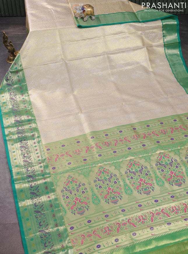 Tissue paithani silk saree cream and teal green with allover silver zari woven brocade weaves and long zari woven paithani style border