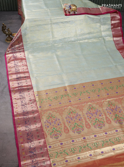 Tissue paithani silk saree pastel green and magenta pink with allover silver zari woven brocade weaves and zari woven paithani style border