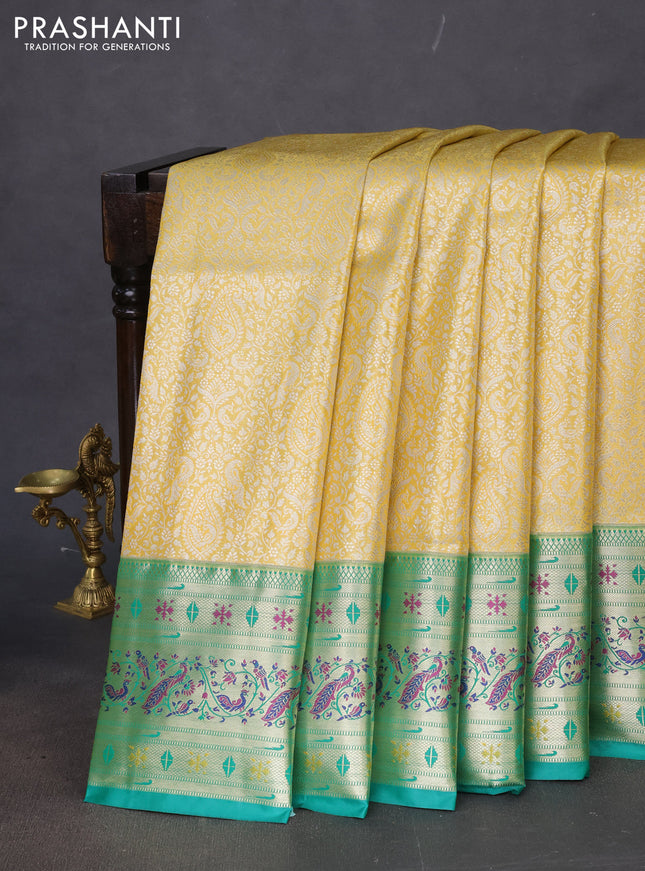 Tissue paithani silk saree yellow and teal green with allover silver zari woven brocade weaves and zari woven paithani style border