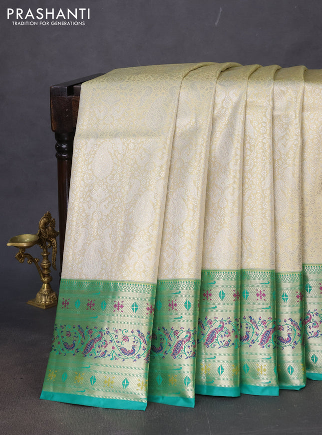 Tissue paithani silk saree cream and teal green with allover silver zari woven brocade weaves and zari woven paithani style border