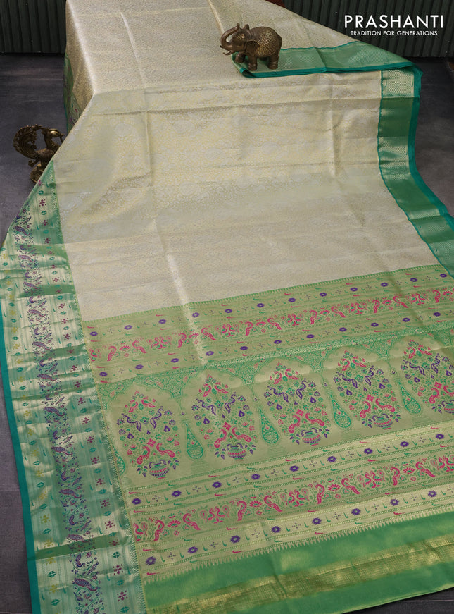 Tissue paithani silk saree cream and teal green with allover silver zari woven brocade weaves and zari woven paithani style border
