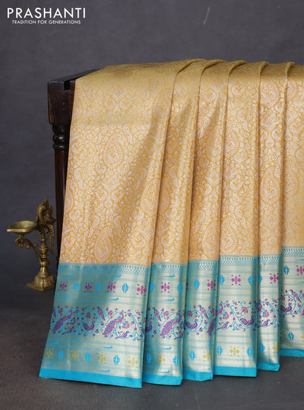 Tissue paithani silk saree mustard yellow and teal green with allover silver zari woven brocade weaves and zari woven paithani style border