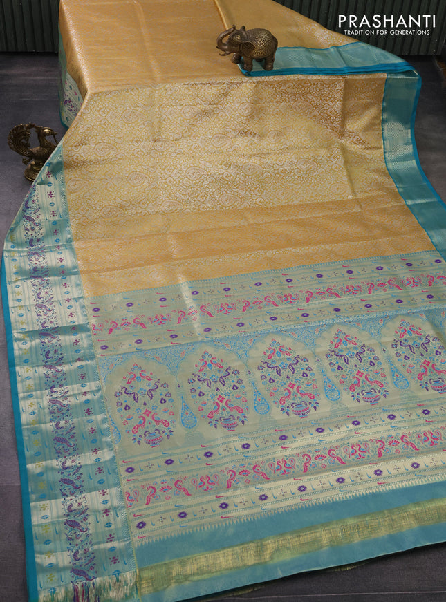 Tissue paithani silk saree mustard yellow and teal green with allover silver zari woven brocade weaves and zari woven paithani style border