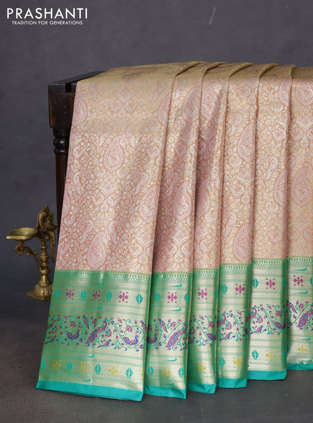 Tissue paithani silk saree pastel peach and teal green with allover silver zari woven brocade weaves and zari woven paithani style border