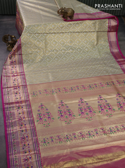 Tissue paithani silk saree pastel grey and magenta pink with allover silver zari woven brocade weaves and long zari woven paithani style border