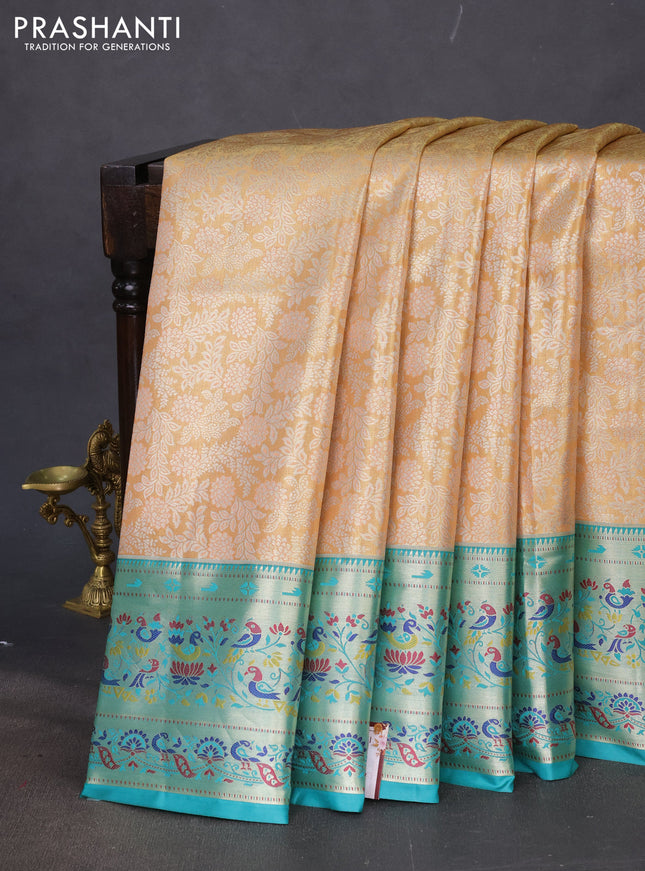 Tissue paithani silk saree dual shade of pale orange and teal blue with allover silver zari woven brocade weaves and zari woven paithani style border