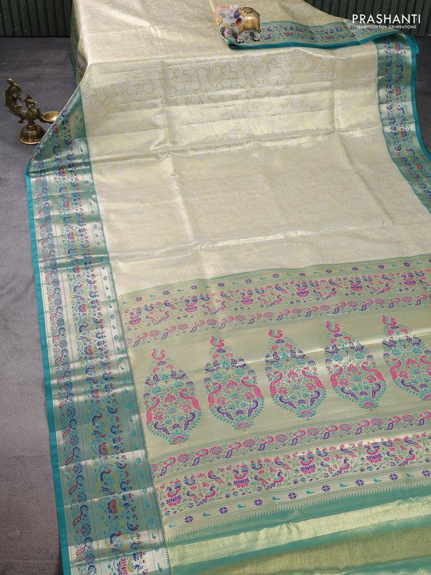 Tissue paithani silk saree cream and teal green with allover silver zari woven brocade weaves and zari woven paithani style border