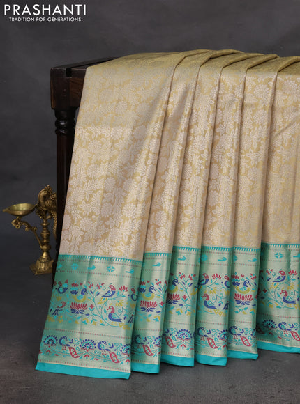 Tissue paithani silk saree cream and teal green with allover silver zari woven brocade weaves and zari woven paithani style border