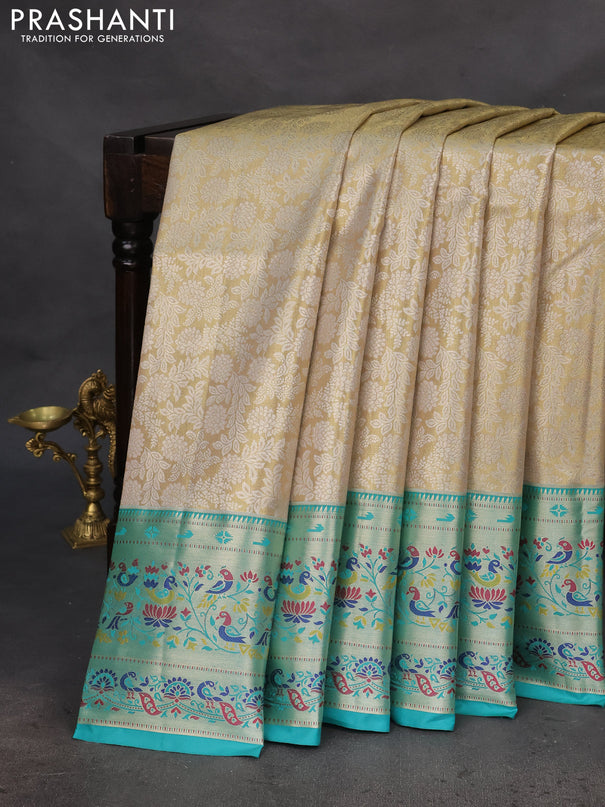 Tissue paithani silk saree cream and teal green with allover silver zari woven brocade weaves and zari woven paithani style border