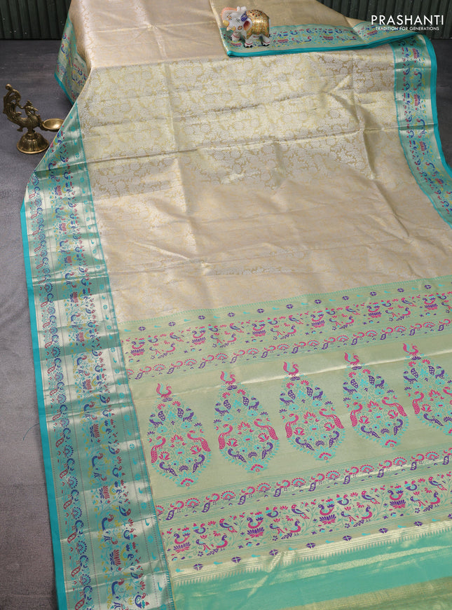 Tissue paithani silk saree cream and teal green with allover silver zari woven brocade weaves and zari woven paithani style border