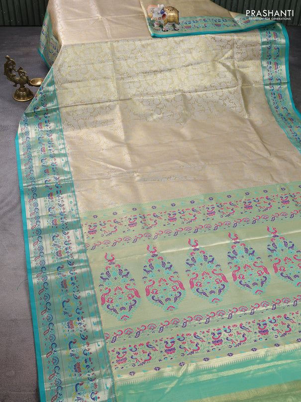 Tissue paithani silk saree cream and teal green with allover silver zari woven brocade weaves and zari woven paithani style border