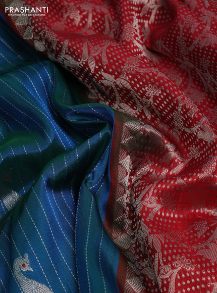 Venkatagiri silk saree dual shade of teal bluish green and red with allover silver zari woven paisley buttas and silver zari woven border