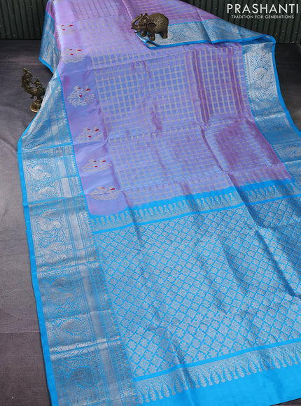 Venkatagiri silk saree dual shade of pastel pink and cs blue with allover silver zari checks and silver zari woven border