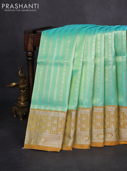 Venkatagiri silk saree teal green and mustard shade with allover silver zari weaves and silver zari woven border