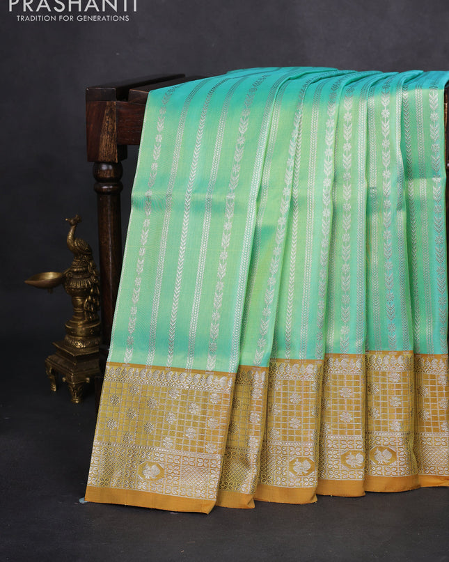 Venkatagiri silk saree teal green and mustard shade with allover silver zari weaves and silver zari woven border