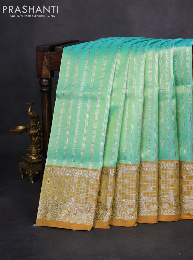 Venkatagiri silk saree teal green and mustard shade with allover silver zari weaves and silver zari woven border