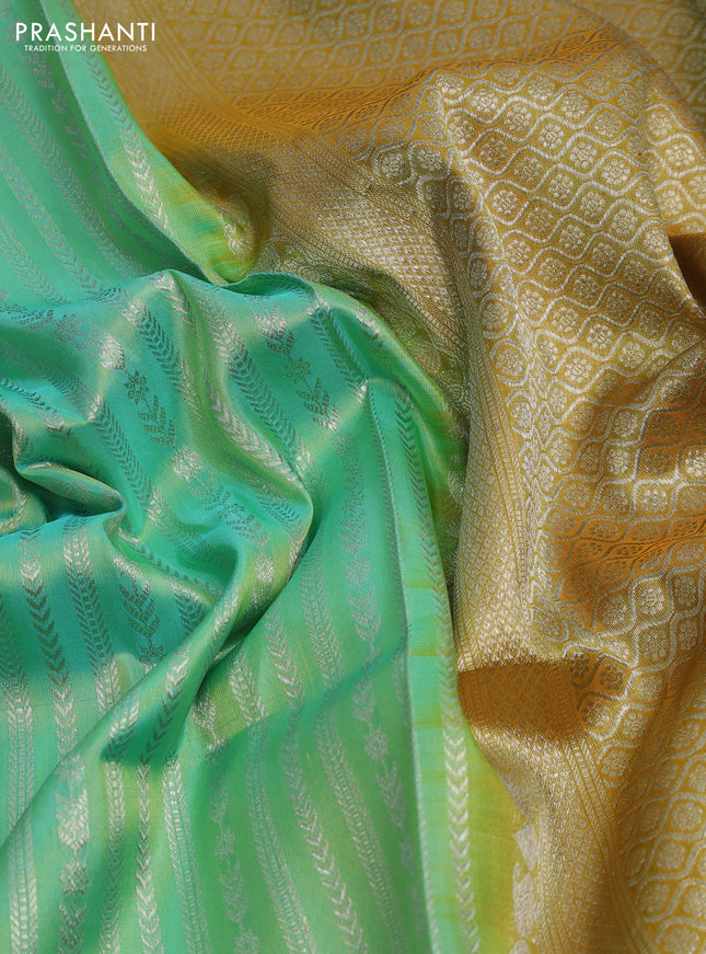 Venkatagiri silk saree teal green and mustard shade with allover silver zari weaves and silver zari woven border