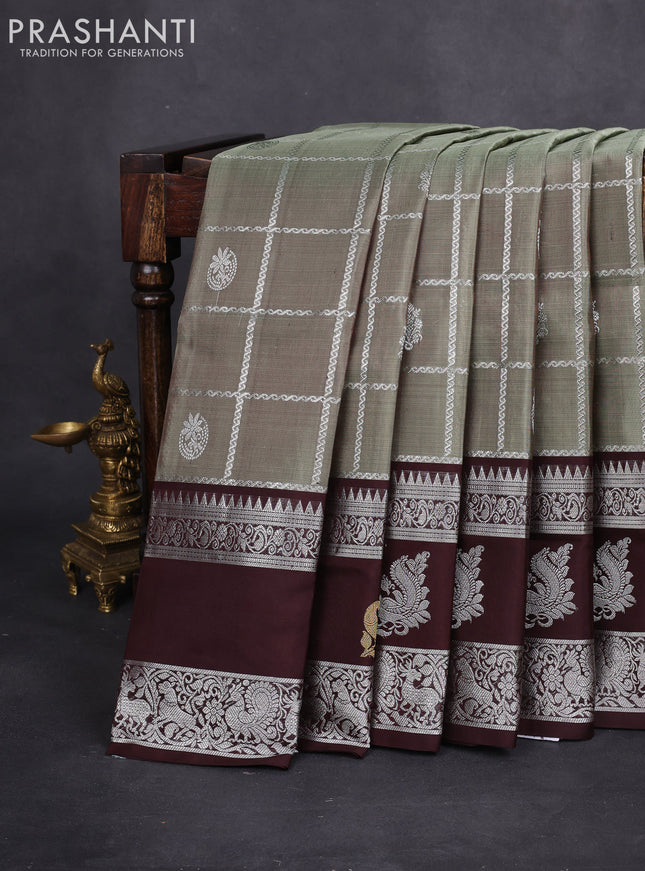 Venkatagiri silk saree pastel green and deep coffee brown with allover silver zari checks & buttas and silver zari woven butta border