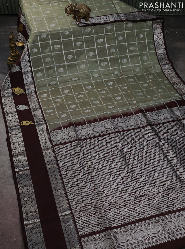 Venkatagiri silk saree pastel green and deep coffee brown with allover silver zari checks & buttas and silver zari woven butta border