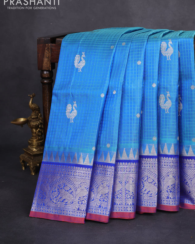 Venkatagiri silk saree teal blue and blue with allover thread checks & silver zari buttas and temple design silver zari woven border