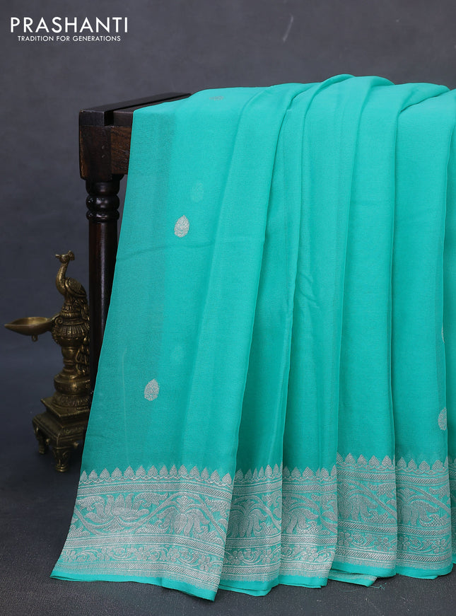 Banarasi chiffon silk saree teal green shade with silver zari woven buttas and silver zari woven border