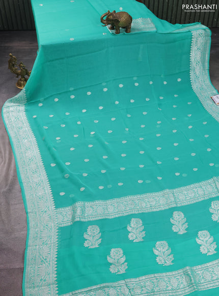 Banarasi chiffon silk saree teal green shade with silver zari woven buttas and silver zari woven border