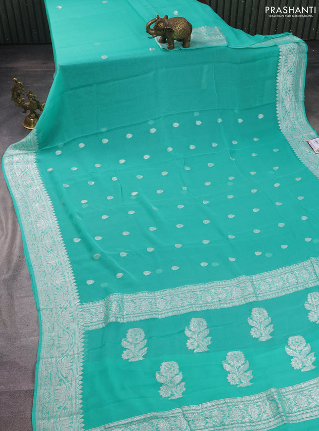 Banarasi chiffon silk saree teal green shade with silver zari woven buttas and silver zari woven border
