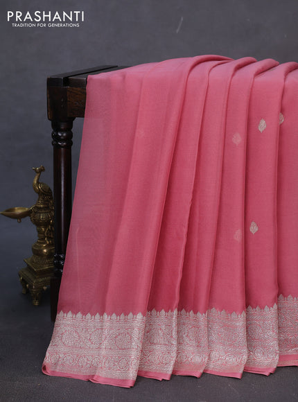 Banarasi chiffon silk saree peach shade with silver zari woven buttas and silver zari woven border