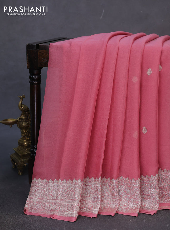 Banarasi chiffon silk saree peach shade with silver zari woven buttas and silver zari woven border