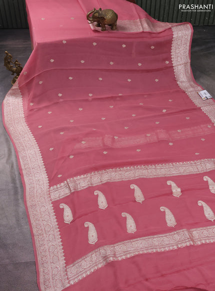 Banarasi chiffon silk saree peach shade with silver zari woven buttas and silver zari woven border