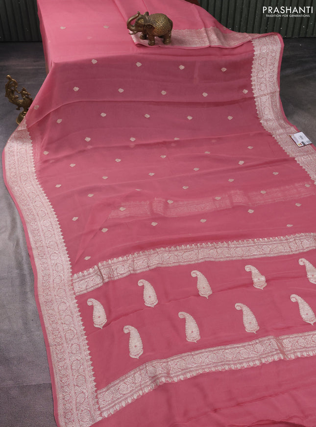 Banarasi chiffon silk saree peach shade with silver zari woven buttas and silver zari woven border