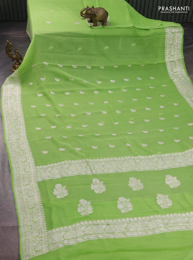 Banarasi chiffon silk saree light green with paisley silver zari woven buttas and silver zari woven border